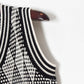 Pull taille haute à col en V croisé et losanges