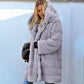 Manteau à capuche ample en peluche de couleur unie en fausse fourrure