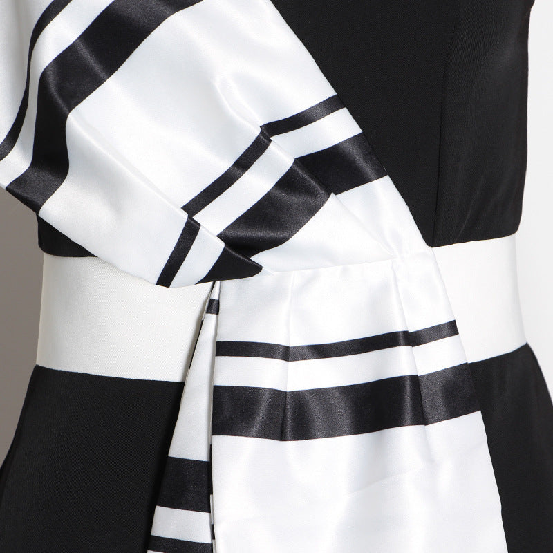 Striped jumpsuit with suspenders and bow