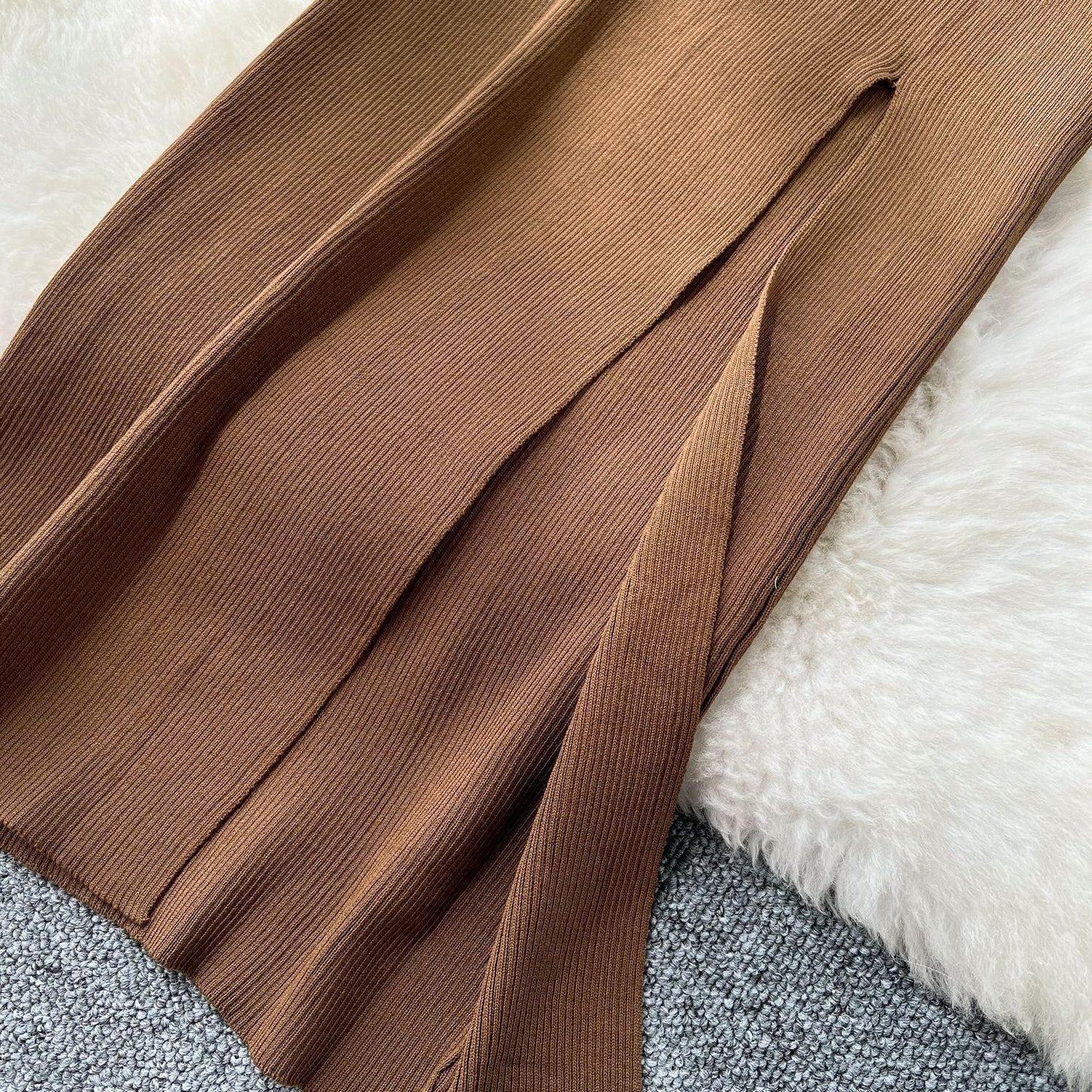 A Two-piece Knitted Vest With A Slimming, Body-hugging, Slit Skirt