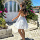 Robe à col suspendu brodé creux, jupe dos nu
