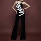 Striped jumpsuit with suspenders and bow