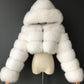 Manteau court à capuche en fausse fourrure à manches longues