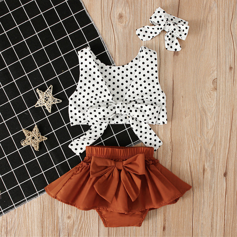 Ensemble trois pièces haut à pois + jupe à nœud