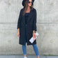 Woolen coat with button pocket and collar