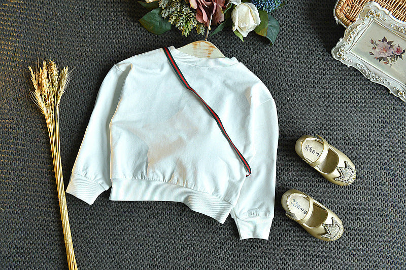 Ensemble pull brodé et jupe à carreaux
