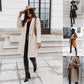 Manteau en laine mi-long à boutons et revers de couleur unie
