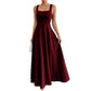 The Woman Is Wearing A Sleeveless Solid-color Dress