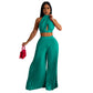 Ensemble deux pièces pour femme avec pantalon large plissé en soie et dos nu