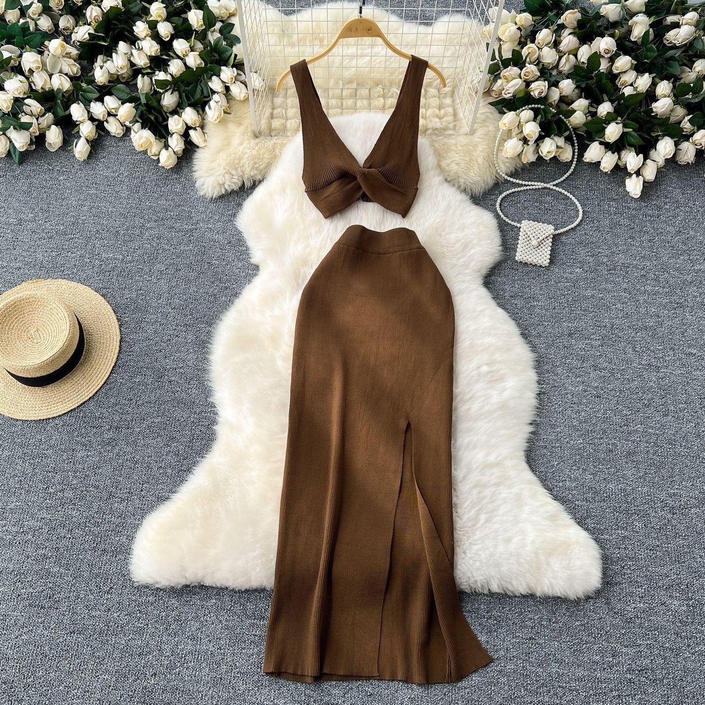 A Two-piece Knitted Vest With A Slimming, Body-hugging, Slit Skirt