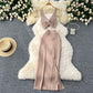 A Two-piece Knitted Vest With A Slimming, Body-hugging, Slit Skirt