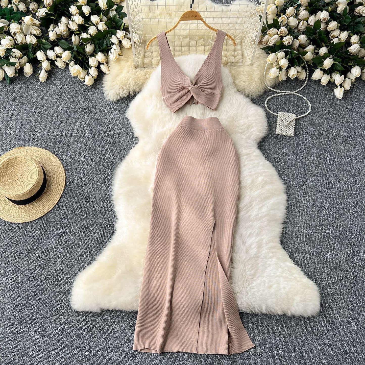A Two-piece Knitted Vest With A Slimming, Body-hugging, Slit Skirt