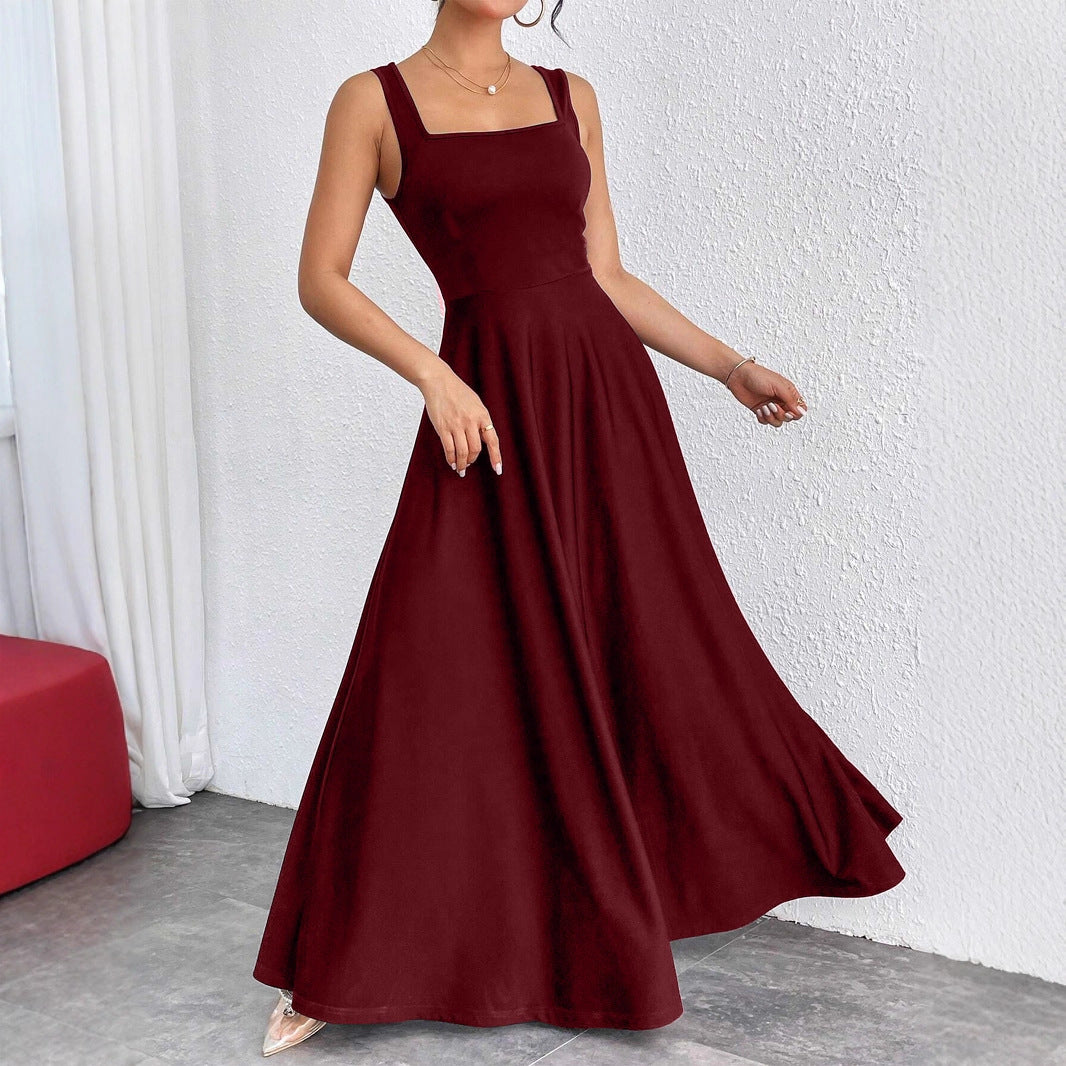 The Woman Is Wearing A Sleeveless Solid-color Dress