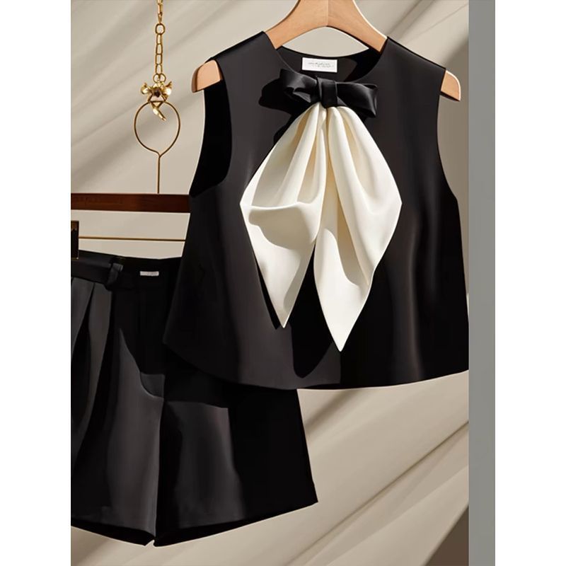 Two-piece Set Featuring A Black Bow-tie Top And Shorts