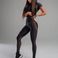 Combinaison de sport à manches mi-longues et fermeture éclair en maille noire pour femme