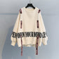 Turtleneck sweater letter holes