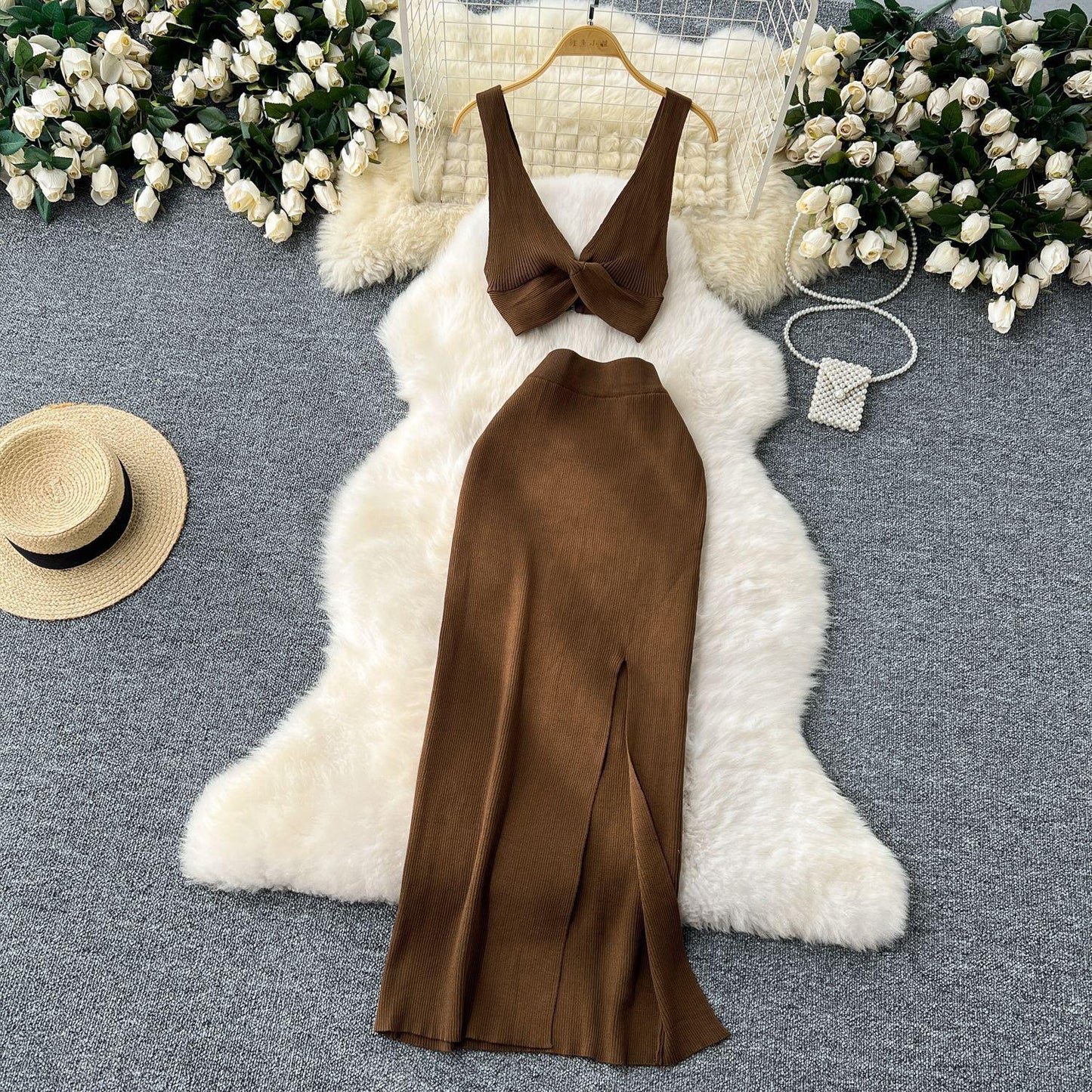 A Two-piece Knitted Vest With A Slimming, Body-hugging, Slit Skirt