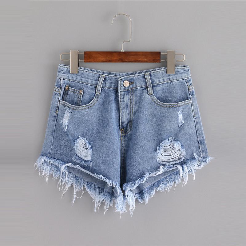 Short en jean à pompons effet vieilli