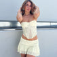 Tenue sexy en dentelle avec jupe portefeuille transparente sur la poitrine