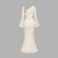 Flared Sleeves With A Butterfly-clasp Design Create A Slimming Ruched Look
