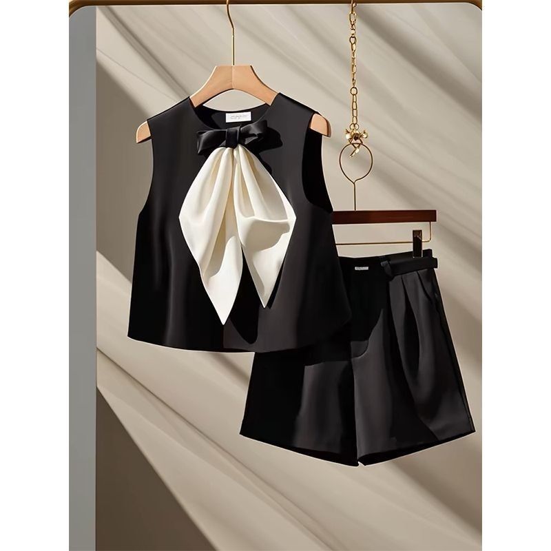Two-piece Set Featuring A Black Bow-tie Top And Shorts