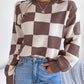 Pull à carreaux contrastés, style ample et décontracté, avec coutures