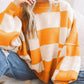 Pull à carreaux contrastés, style ample et décontracté, avec coutures