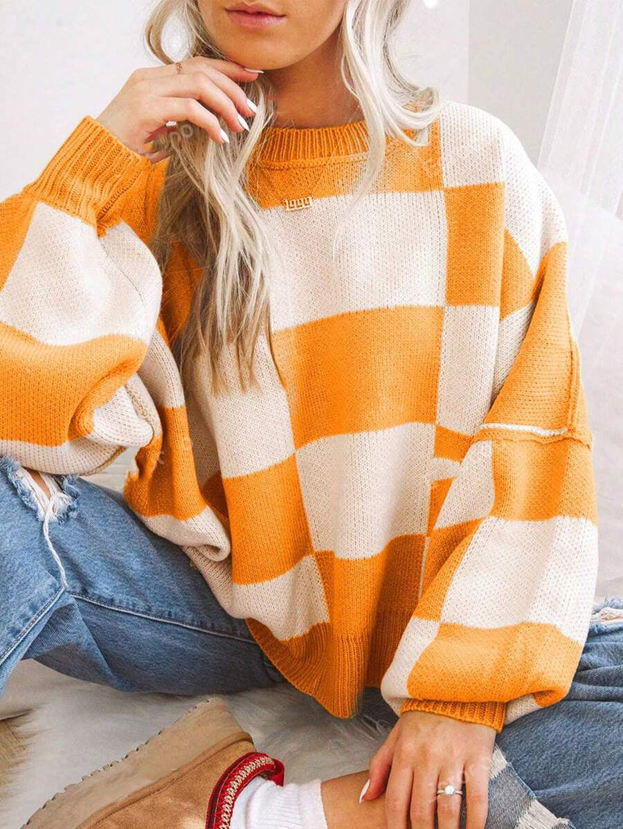 Pull à carreaux contrastés, style ample et décontracté, avec coutures