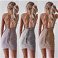 sling featuring a backless slim dress