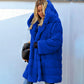 Manteau à capuche ample en peluche de couleur unie en fausse fourrure