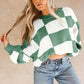 Pull à carreaux contrastés, style ample et décontracté, avec coutures