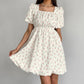 Robe élégante à manches bouffantes et à fleurs françaises
