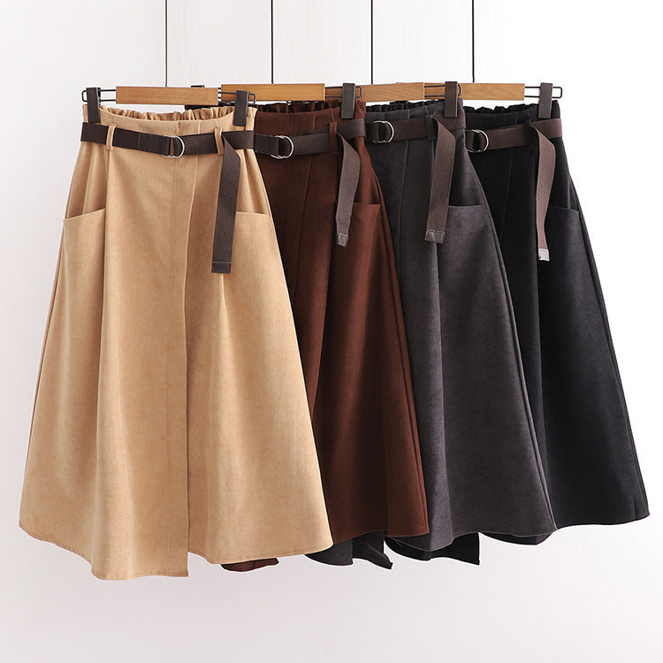 Jupe mi-longue irrégulière amincissante taille haute à poches artistiques de couleur unie