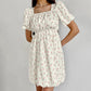 Robe élégante à manches bouffantes et à fleurs françaises