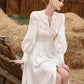 Robe à simple boutonnage en dentelle blanche brodée de fleurs, lanterne ajourée, manches longues, lacets