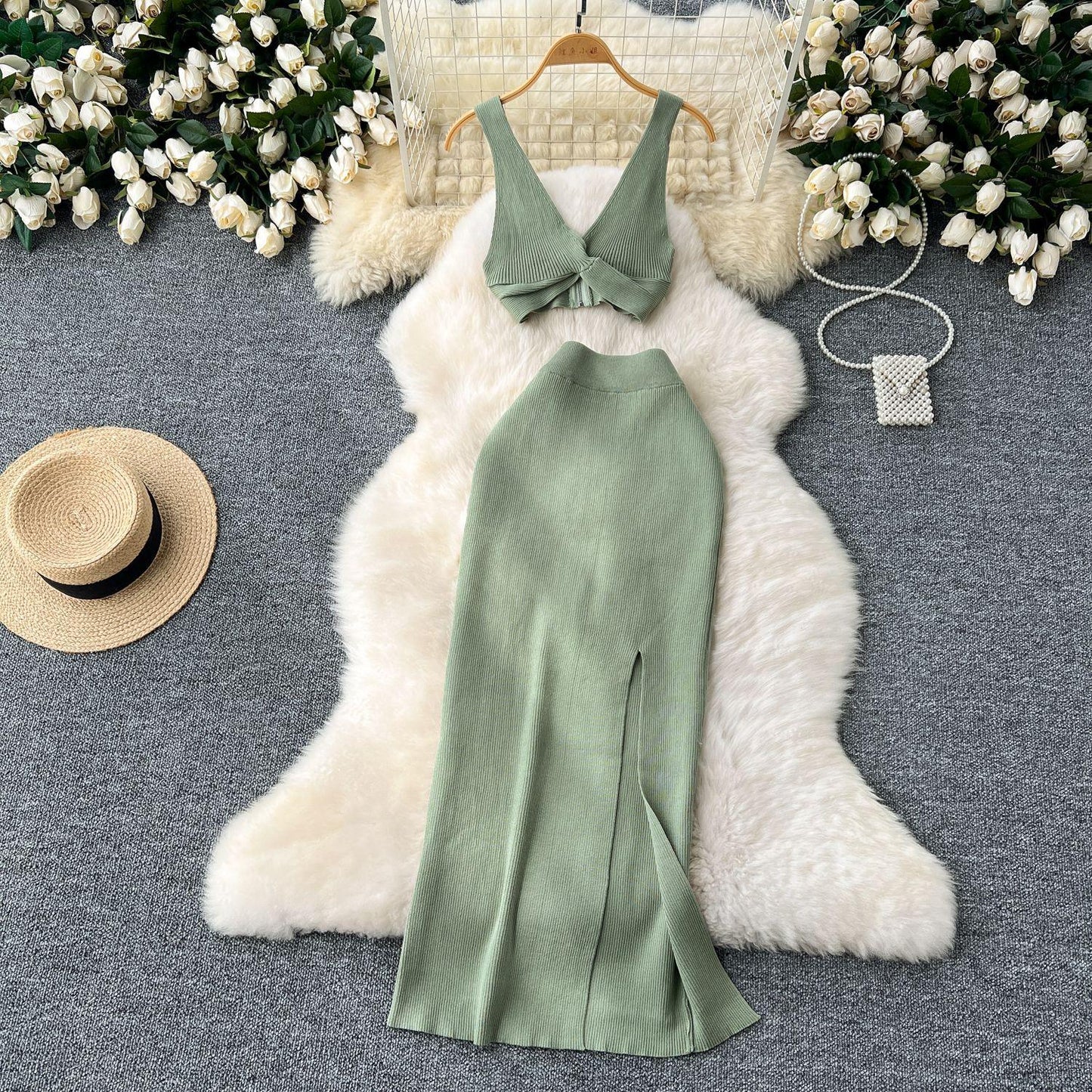 A Two-piece Knitted Vest With A Slimming, Body-hugging, Slit Skirt