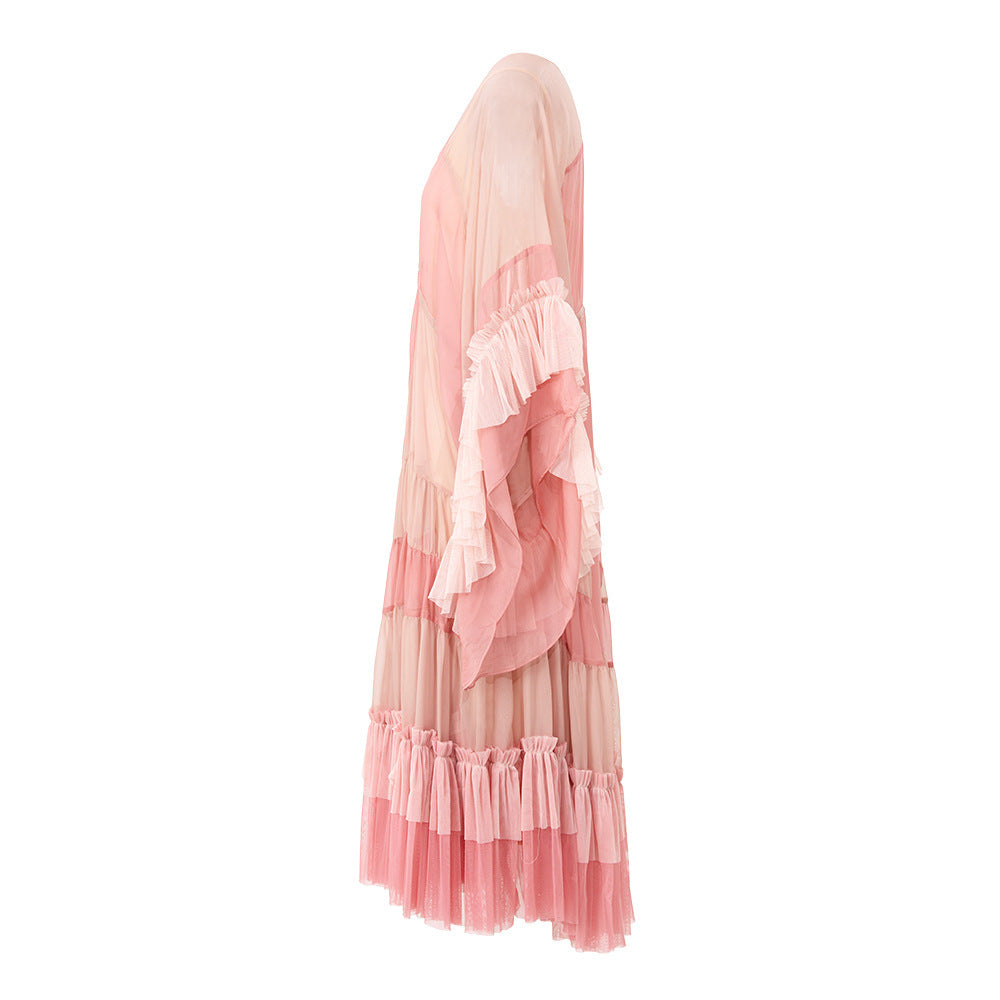 Jupe mi-longue à lacets et pompons tendance, manches chauve-souris, col en V