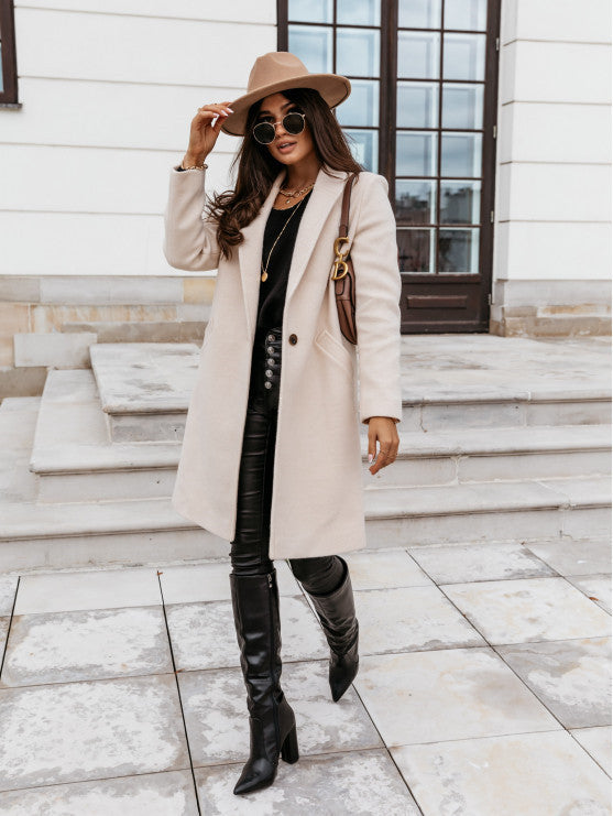 Manteau en laine mi-long à boutons et revers de couleur unie