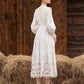 Robe à simple boutonnage en dentelle blanche brodée de fleurs, lanterne ajourée, manches longues, lacets